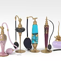 Vintage Decorative Perfume Bottles With Ornate Gold Accents And Colorful Designs