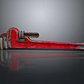 Red Vintage Pipe Wrench Tool On Black Background With Reflection Effect