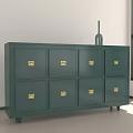 Green Cabinet With Golden Handles And Eight Drawers By Window With Vase