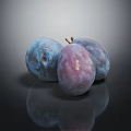 Three Fresh Ripe Blue Purple Shiny Plums with Reflections on Dark Background