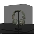 Ancient Bronze Earring Sculpture With Intricate Carving In Transparent Museum Display Case