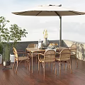 Outdoor Patio Rattan Table Chair Set With Umbrella And Potted Plants On Wooden Deck