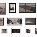 Gallery Wall Display of Black and White Photos with Landscapes Architecture and Bicycle