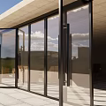 Modern Building With Large Glass Doors And Wooden Tables Inside Stone Tile Floor