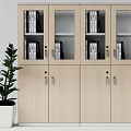 Light Wood Bookcase With Glass Doors And Wooden Cabinets Holding Books And Potted Plant Beside