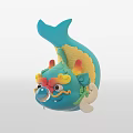 Blue Fish Shaped Doll With Lion Like Face Yellow Accents And Blowing Bubble