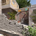 Traditional Multi Story Old Buildings With Climbing Plants Stone Steps And Purple Flowers Area