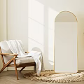 Modern Minimalist Living Room With Wooden Armchair Round Rug Floor Mirror And Sunlight