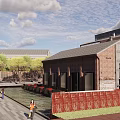 Charming Commercial Street Featuring Red Brick Buildings Outdoor Seating And Pedestrians With Trees