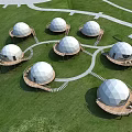 Scenic White Dome Structures Arranged On Green Grassland With Winding Paths 3d model
