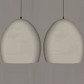 Two Beige Textured Oval Shaped Pendant Lights Hanging On Minimalist Wall