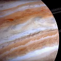 Detailed View Of Jupiter With Visible Rings And Colorful Atmospheric Stripes