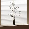 Dark Stone Vase with Slender Branches and Tiny Flowers on Windowsill Against White Blinds