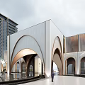 Modern Building Exterior With Curved Arches Water Feature Sculpture In Open Plaza High Rise Background