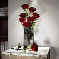 Decorative Ornament Combination with Red Roses in Transparent Vase on Marble Tabletop