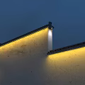 Warm Yellow Decorative Lights Illuminating Traditional Building Walls With Black Tiled Roof At Night