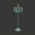 Floor Standing Candle Holder With Multiple Candle Arms And Ornate Metal Base