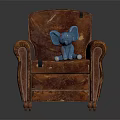 Brown Leather Armchair With Blue Elephant Toy And Classic Design