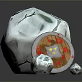 Decorative Grey Stone Object With Round Shield Featuring Red And Yellow Pattern And Small Stones