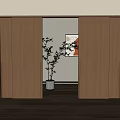 Modern Wooden Sliding Doors in Home Interior with Potted Plant and Artwork