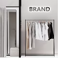 Modern Clothing Store With Fashion Clothes Hanging Rack Glass Door Wardrobe And Brand Sign