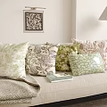 Throw Pillows With Floral And Geometric Patterns On Beige Sofa With Lamp And Wall Art