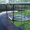 Outdoor Pergola Design with Green Lawn Trees and Curved Pathway and Serene Water Feature