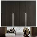 Modern Black Wardrobe With Metal Handles Mirror Side Shelf Holding Vases Dried Flowers And Books
