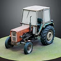 Old Orange Green Tractor Model With Large Tires On Green Circular Base