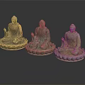 Three Ornate Seated Buddha Statues With Different Color Tones On Lotus Bases