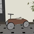 Stylish Brown Children's Toy Car With White Seat And Silver Steering Wheel On Checkered Rug