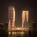Modern Office Towers at Night With Unique Curved Exterior and Illuminated Facade Design