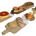 Various Types of Baked Goods on Wooden Boards Including Bread Donut Croissant and Cake