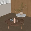 Wooden Round Coffee Table with White Side Table and Green Plants in Living Room Interior