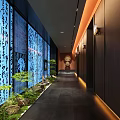 Hotel Corridor With Blue Calligraphy Walls Green Plants Stone Flooring And Warm Lighting
