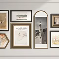 Assorted Framed Wall Artworks On White Wall With Various Styles And Shapes