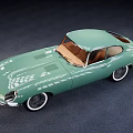 Vintage Green Sports Car With Brown Interior And White Wheels Design