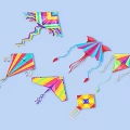 Vibrant Colorful Kites With Various Shapes And Designs On Blue Background