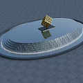 Garden Ornament Circular Pool With Stepped Edges Golden Cube On Black Base And Water Reflection