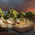 Campsite with Tents Wooden Fence and Tables in Natural Setting Under Red Sunset Sky