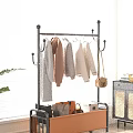 Indoor Garment Rack With Hanging Sweaters Coats And Storage Basket For Bags