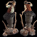 Artistic Female Sculptures With Dresses Wooden Stumps Twigs And Rocks