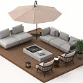 Outdoor Sofa on Wooden Deck with Umbrella Fire Pit Table Chairs Potted Plant and Lanterns