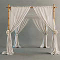 Elegant Bamboo Frame Tent With White Drapery And Decorative Flower Accents