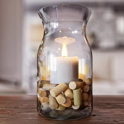 Transparent Glass Candle Lamp With Lit White Candle And Cork Decorations On Wooden Tabletop 3d model