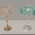 Two Stylish Table Lamps With Leaf Pattern Shades And Gold Silver Bases