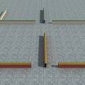 Elongated Architectural Components In Green Yellow Red On Gray Stone Paved Ground