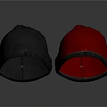 Two Gray And Red Velvet Fabric Hats With Stitched Edges On Dark Background