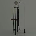 Oval Standing Mirror with Black Metal Stand and Small Wooden Shelf in Home Interior Decor