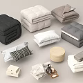 Neutral Colored Bedding Items Including Folded Comforters Pillows Blankets And Storage Accessories